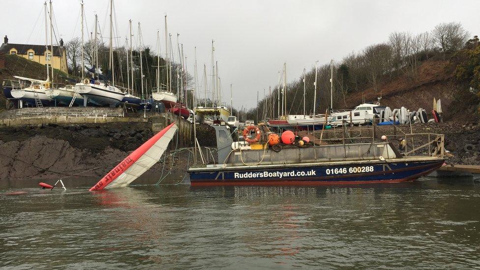 The aircraft being recovered from the river