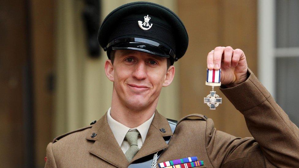 Deacon Cutterham with his Conspicuous Gallantry Cross at Buckingham Palace