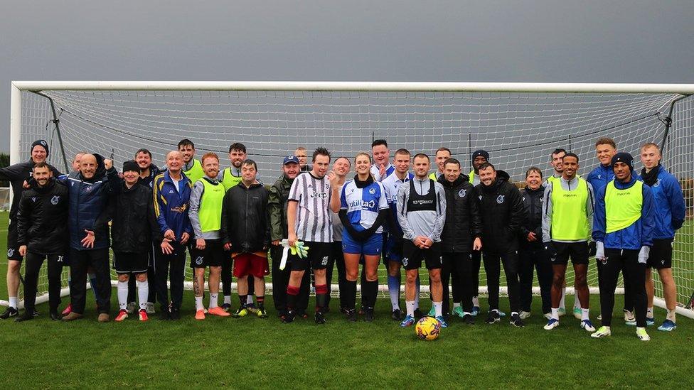 Members of the Rebound with Rovers group pictured by a goalpost