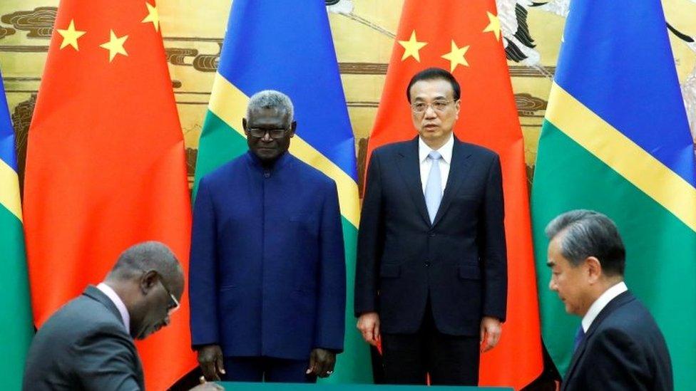 Solomon Islands Prime Minister Manasseh Sogavare, Solomon Islands Foreign Minister Jeremiah Manele, Chinese Premier Li Keqiang and Chinese State Councillor and Foreign Minister Wang Yi attend a signing ceremony at the Great Hall of the People in Beijing