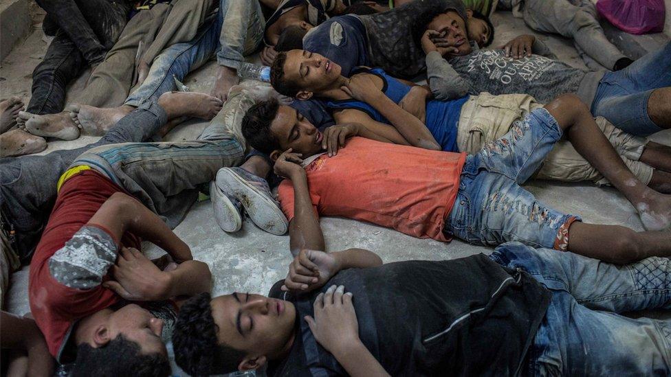 Young Egyptians detained at a police station sleep on the floor in Rosetta, Egypt, after rescued from a boat capsized off the Mediterranean coast near the Egyptian city of Alexandria, Wednesday, Sept. 21, 201