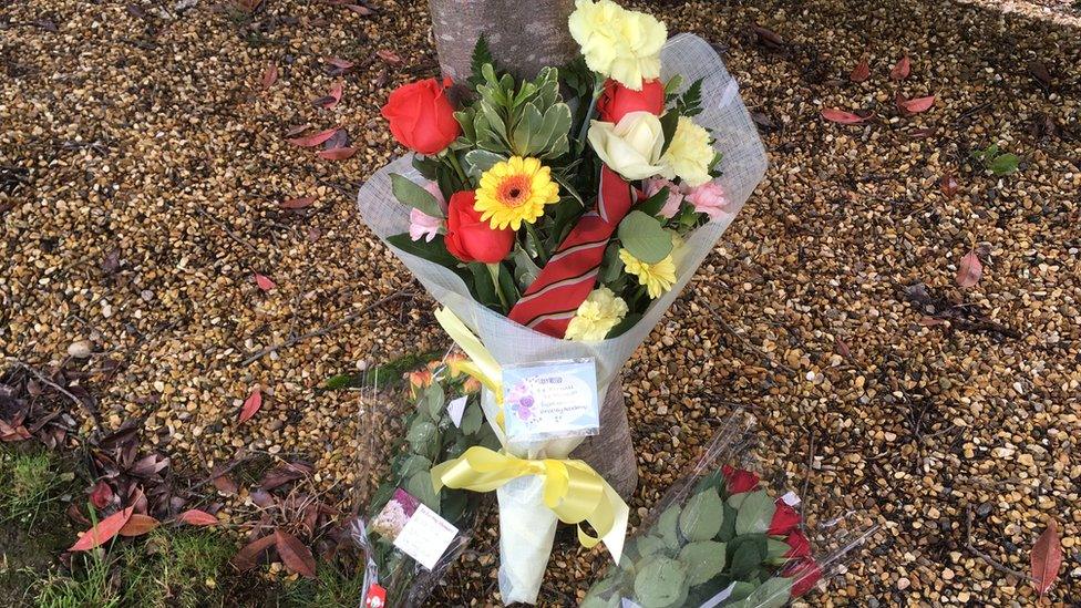 Flowers left by students and staff from Hinckley Academy