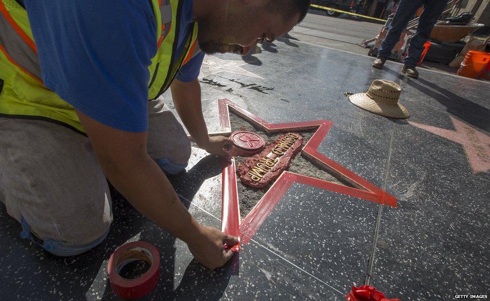 Workers repair the star