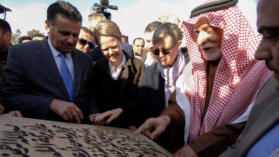 The head of Iraq's Sunni Endowment, Abdul Latif al-Humayim, touches the cornerstone for the new Great Mosque of al-Nuri in Mosul (16 December 2018)