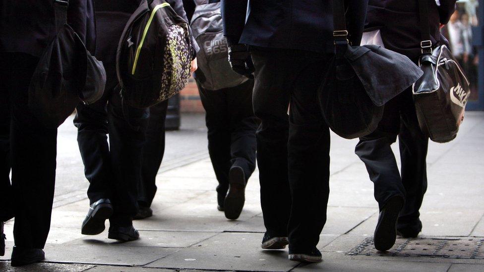 Students walk down the street