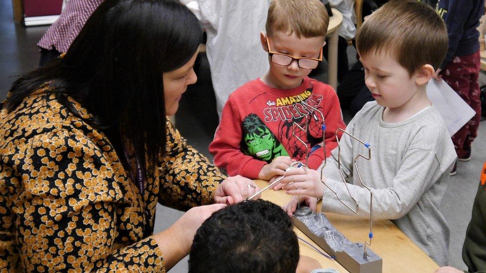 Children take part in a science lesson at Tower View Nursery in Glasgow