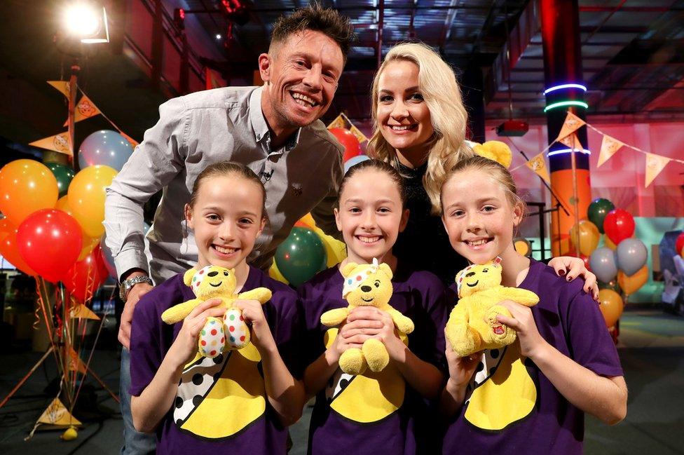 Triplets Armani, Saffarah and Tiara with Children in Need presenters Stephen Clements and Holly Hamilton