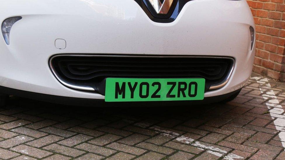 car with green number plate