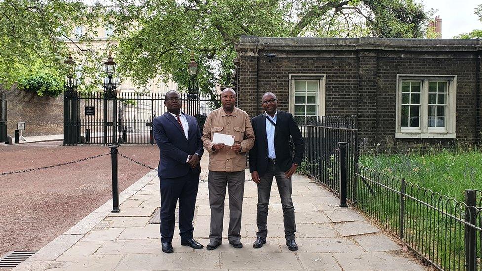 Advocates for the Talai community outside Kensington Palace