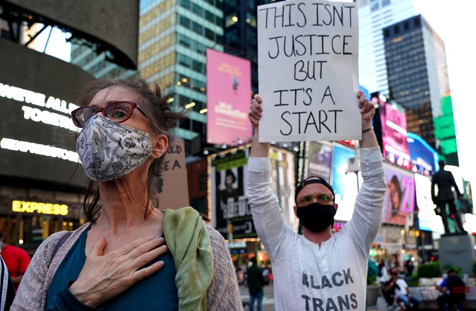 People rally in Times Square in New York City, on 20 April 2021