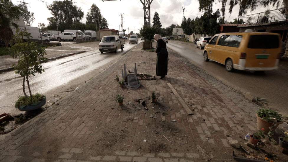 Ibtesam Asous, the mother of the four visiting the site of the strike