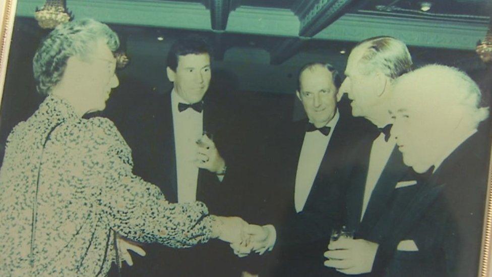 Peggy Crimp shaking Prince Philip's hand