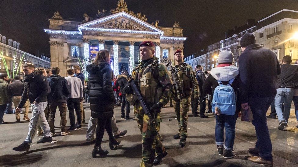 Soldiers patrol as people see in the New Year in the historic centre of Brussels. The New Year's Eve fireworks display and all official events were cancelled in Belgium's capital