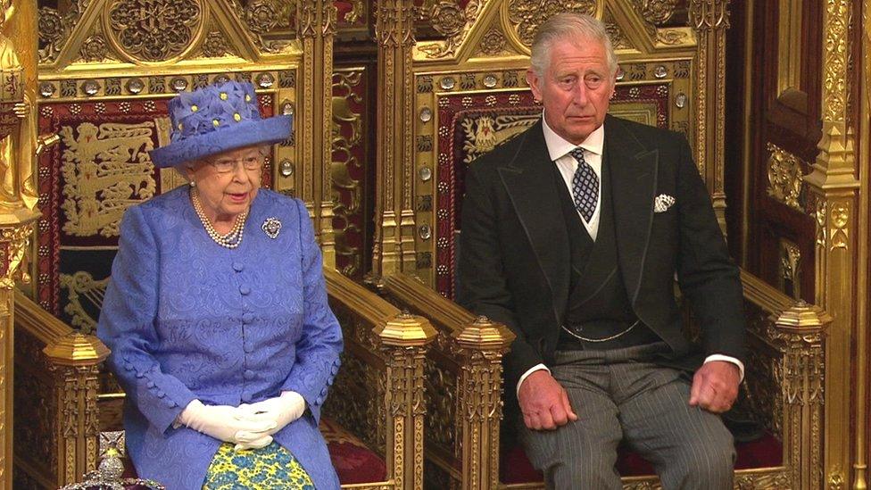 The Queen accompanied by Prince Charles