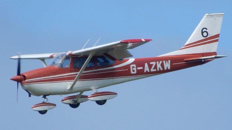 Light aircraft flying above Guernsey