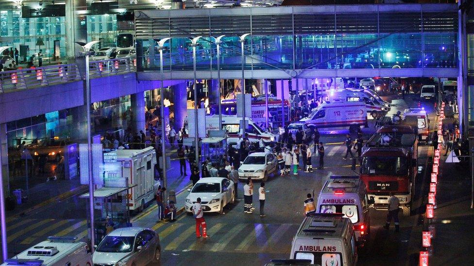 Security and rescue personnel gather outside Istanbul's Ataturk airport after attack on 29 June