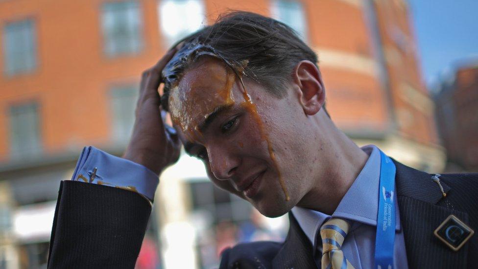 A conference delegate after being hit with an egg