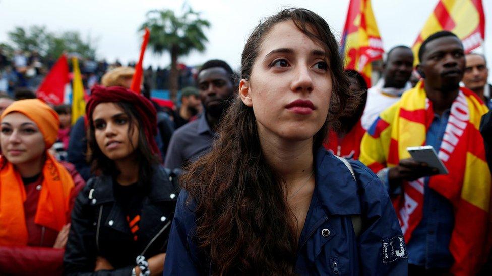 People demonstrate in support of the mayor of the town Domenico Lucano in front of his house in the southern Italian town of Riace