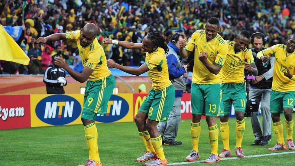 Siphiwe Tshabalala (C) of South Africa celebrates scoring the first goal with team mates during the 2010 FIFA World Cup South Africa Group A match between South Africa and Mexico