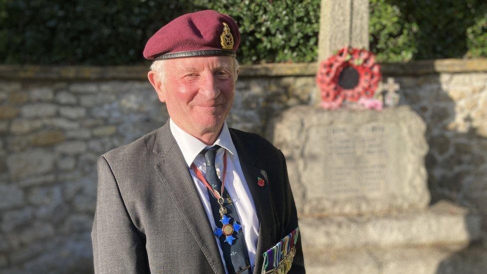 Major General Bill Moore wearing a poppy and his military medals