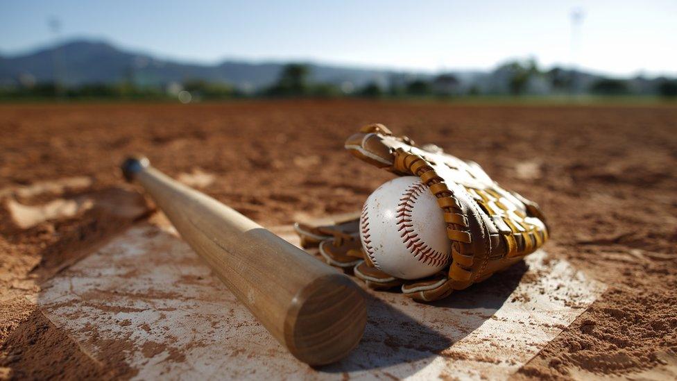 baseball-and-bat-on-the-pitch.