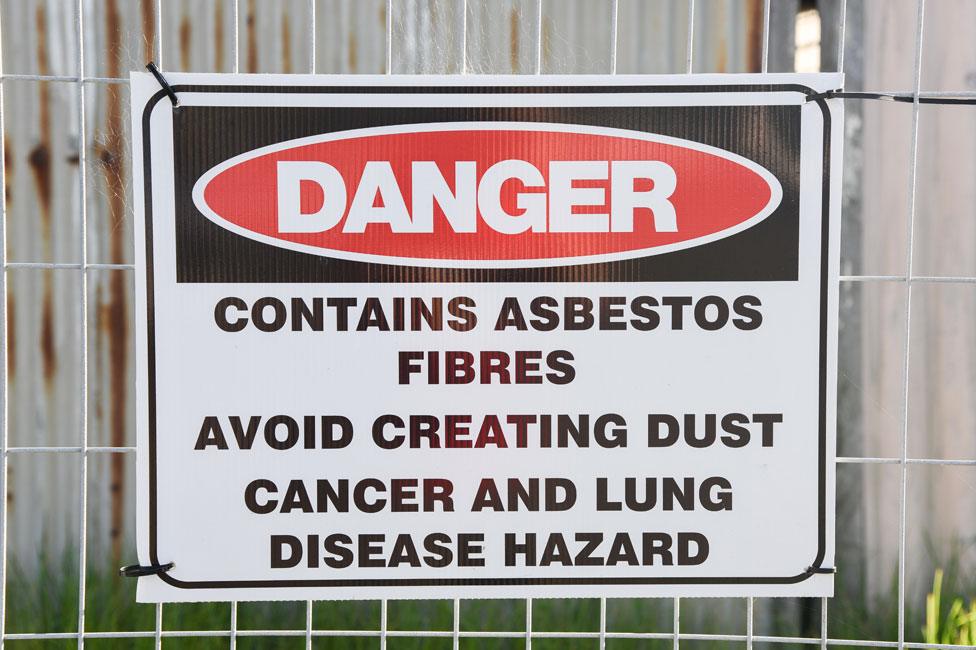 A sign warning of the dangers of asbestos