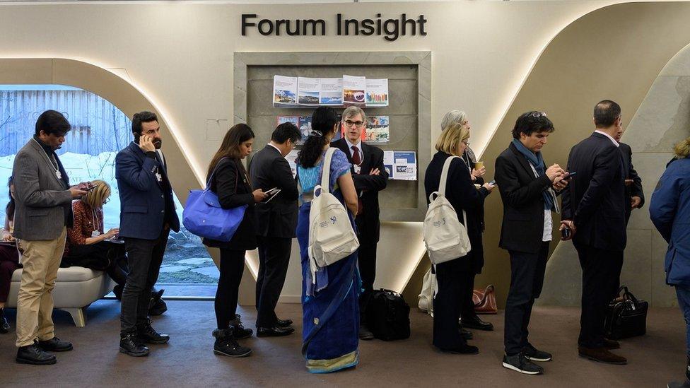 Delegates queuing for a session at Davos