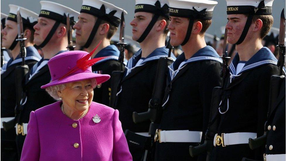 Queen Elizabeth II inspects the Guard of Honour as she arrives for a visit of the Royal Navy's HMS Ocean at Her Majesty's Naval Base Devonport, Plymouth, south west England, on March 20, 2015.