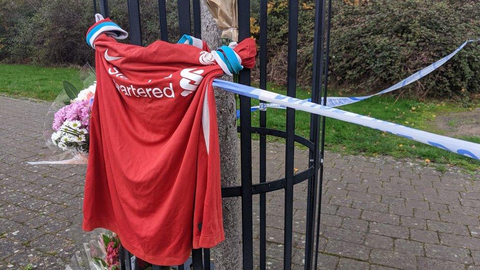 Football shirt tied to railings