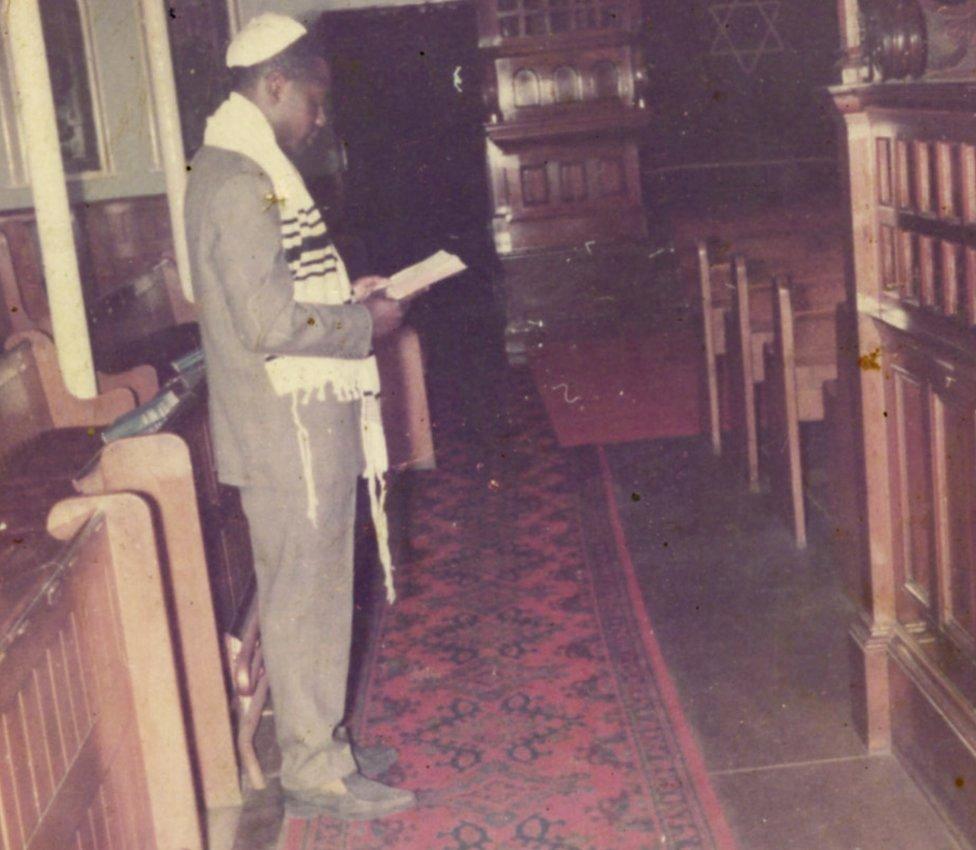 Man worshipping in a synagogue