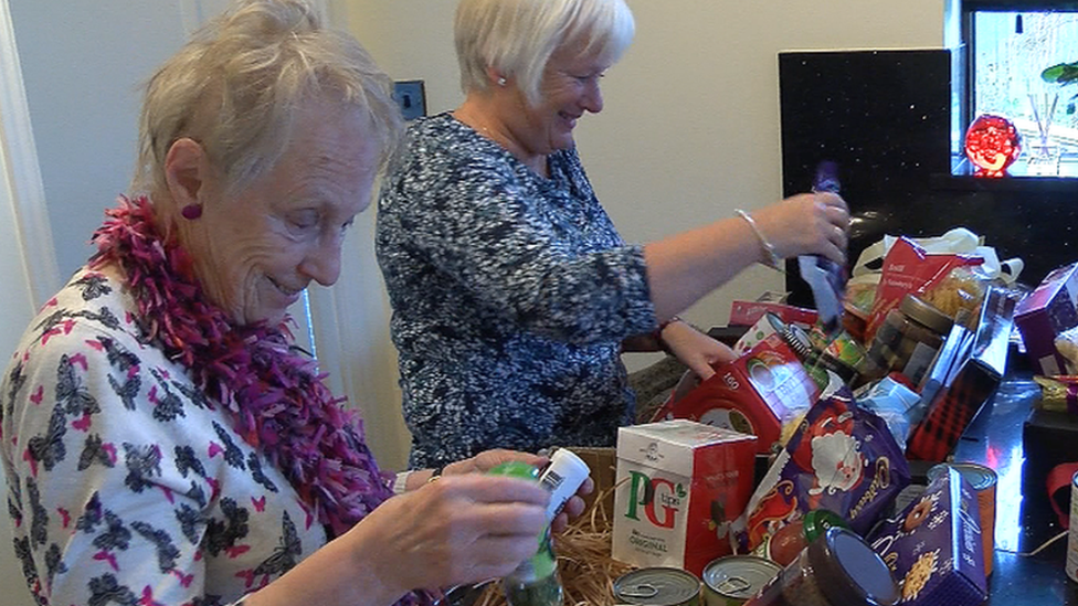 Volunteers pack welcome boxes for Syrian refugees