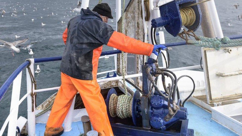 Fisherman on trawler