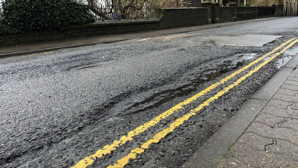 Image of a pothole along Abbey Road in Malmesbury.