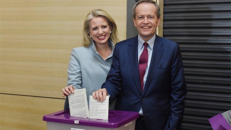 Bill Shorten casts his vote earlier on Saturday with wife Chloe at a school in Melbourne