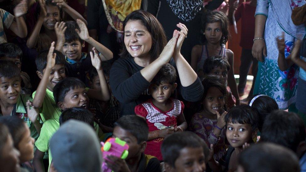 Jessie with children in the camps