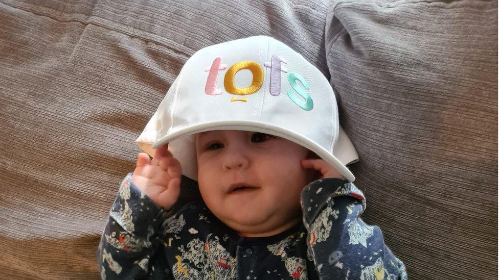 Baby Corey wearing a TOFS charity hat