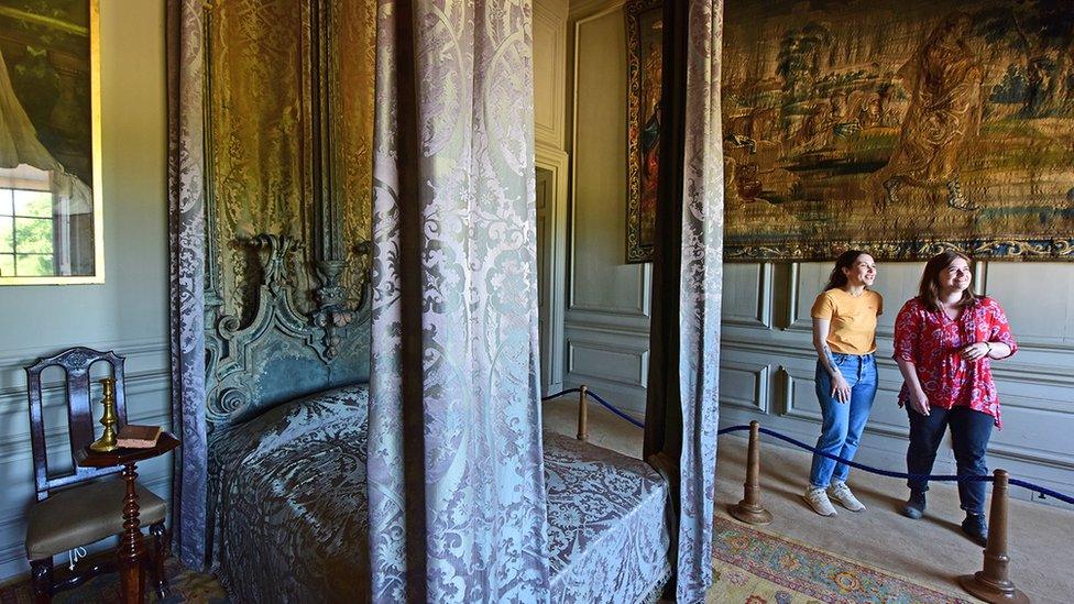 Two women admiring a bedroom interiors