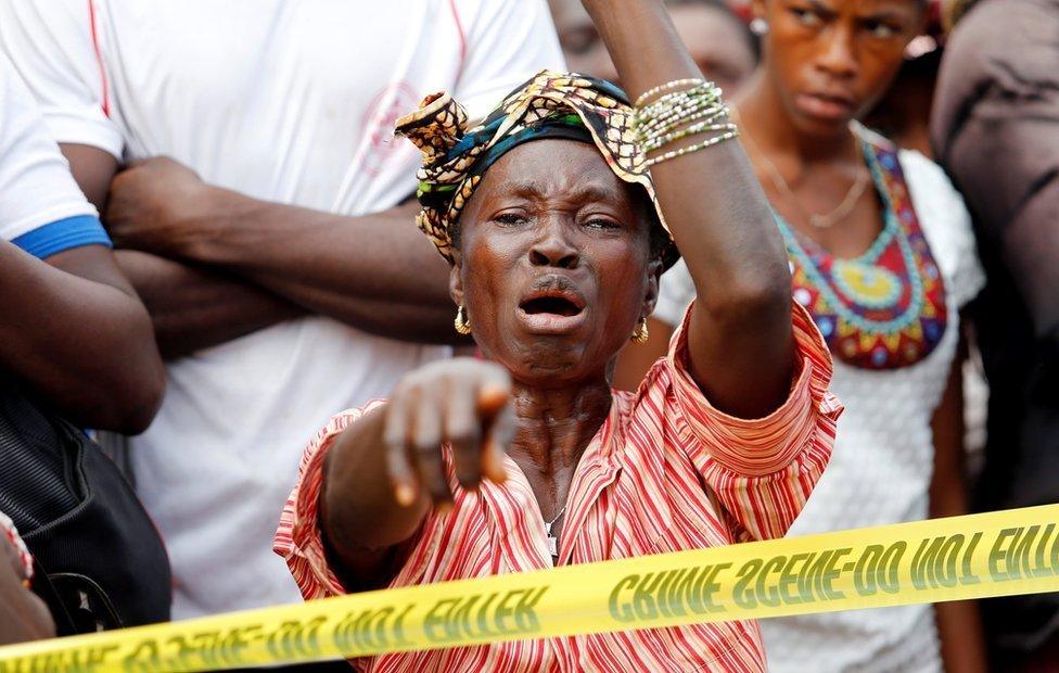 A mother who lost her son during the mudslide reacts near the entrance of Connaught Hospital in Freetown, Sierra Leone August 16, 2017.