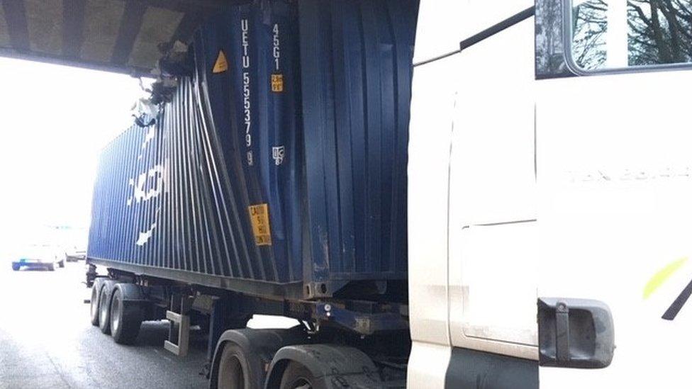 Lorry stuck under the rail bridge