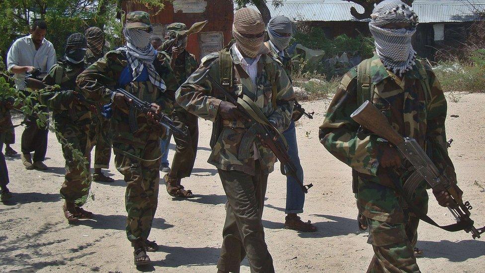 File image from March 5, 2012 shows al-Shabab recruits walking down a street in the Deniile district of Somali capital, Mogadishu