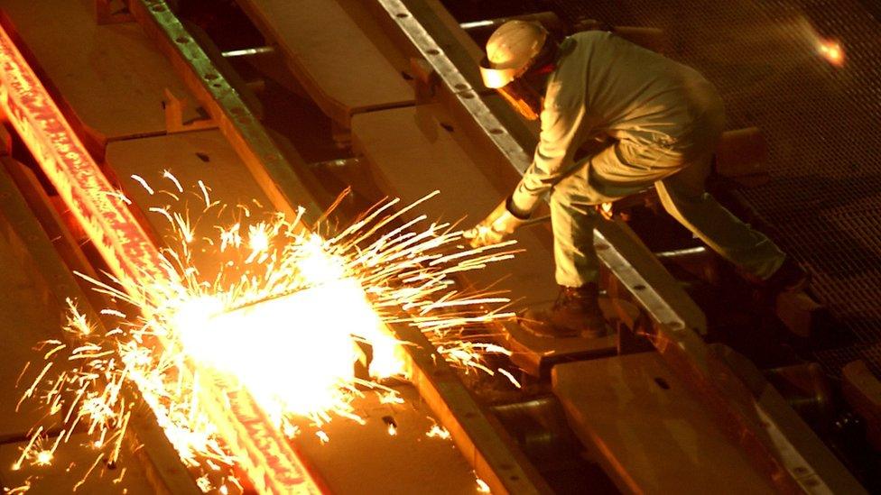 A worker at the Tamco steel mini mill in Rancho Cucamonga, California. October 4, 2002