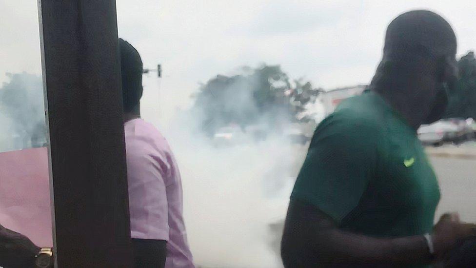 People run during a protest in Abuja, Nigeria, October 9, 2020