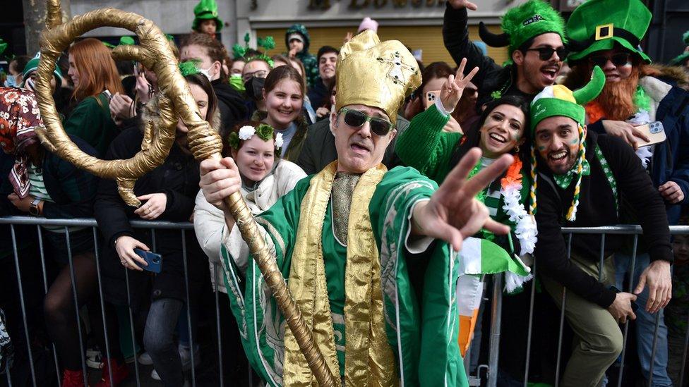 A man in fancy dress poses for a photo as Dubliners celebrate St Patrick's Day on March 17, 2022 in Dublin, Ireland. St Patrick's Day celebrations return to the streets of Dublin after a two-year absence, due to the Covid-19 pandemic.