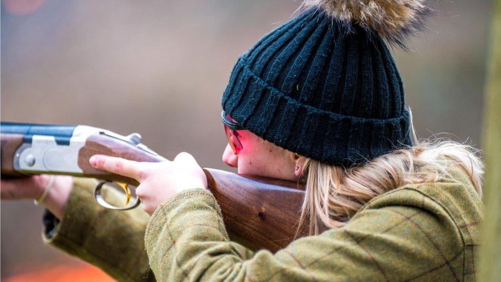 Woman holding a gun