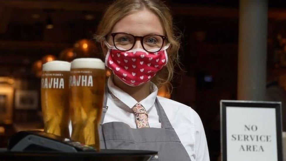 Bartender serving drinks