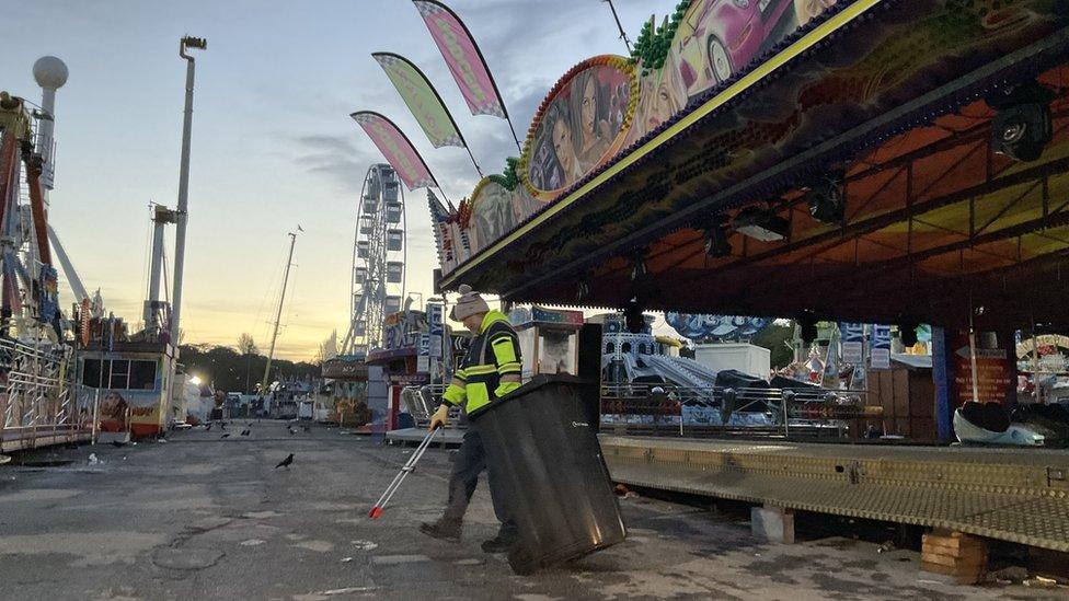 A man picks up rubbish