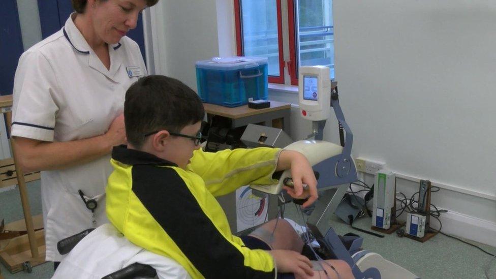 A young patient at the spinal injuries clinic at the Royal National Orthopaedic Hospital