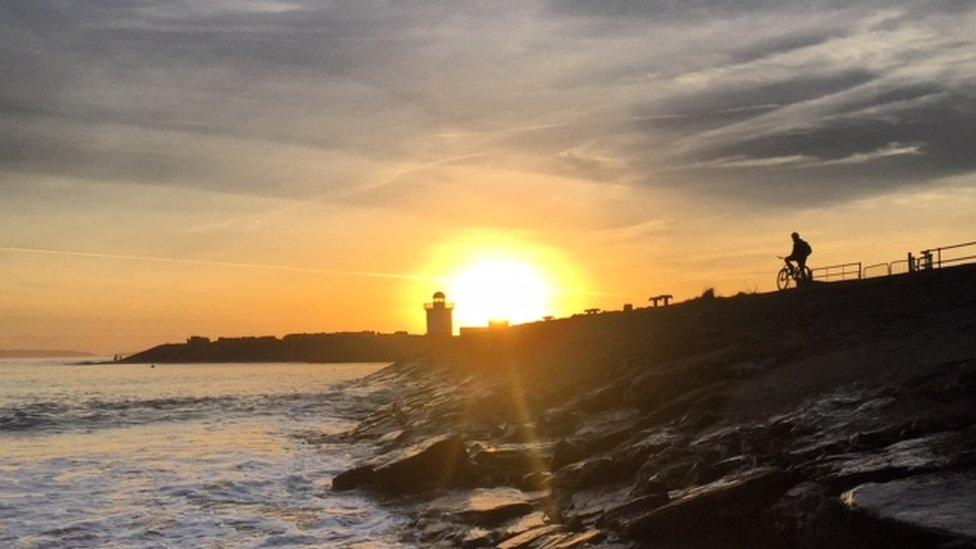 Cyclist at Burry Port sunset