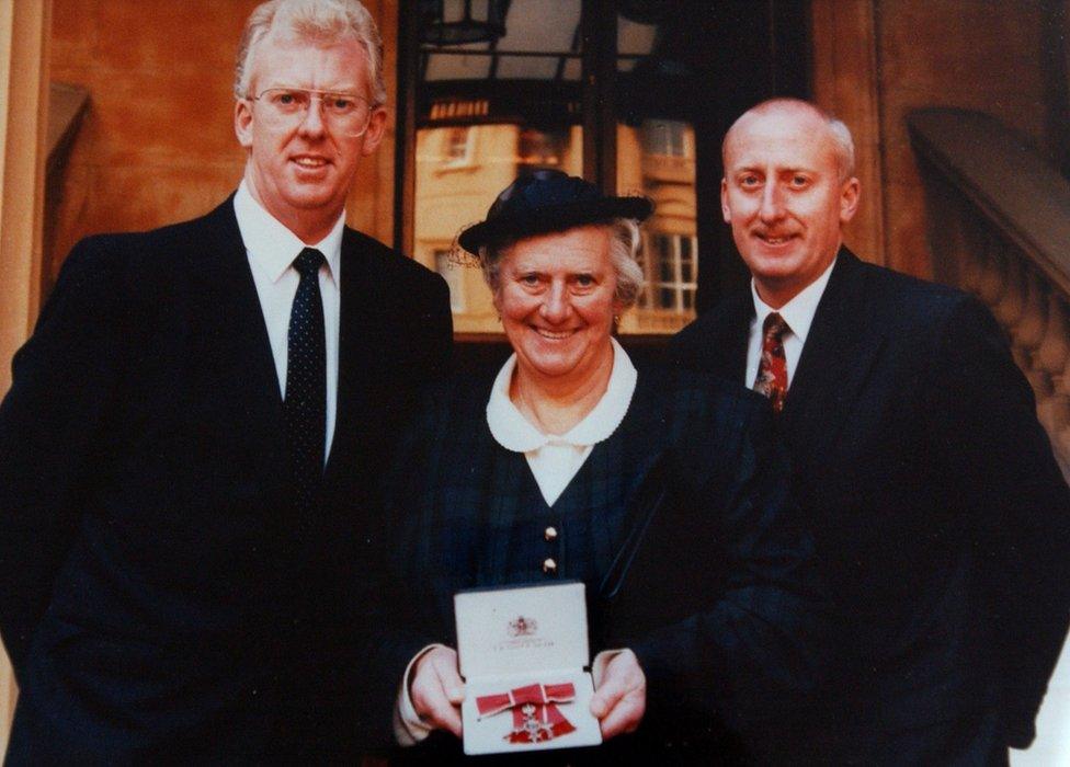 Peggy Cole and her sons