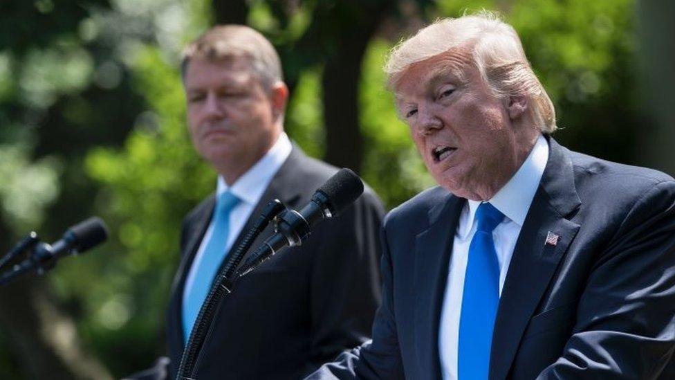 US President Donald Trump and Romania's President Klaus Iohannis appear at the White House.